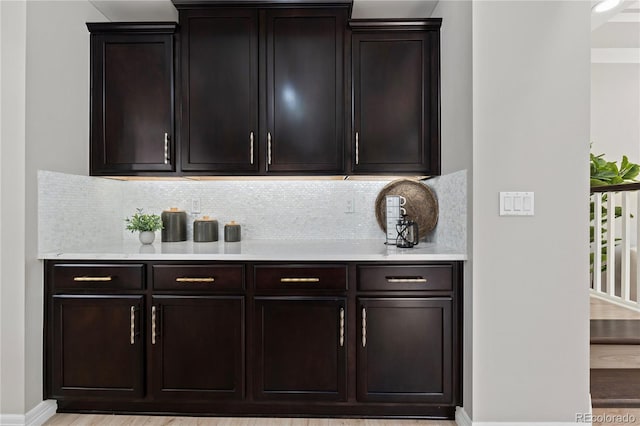 1815 Avery Way, Castle Rock, CO 80109 - bar area with backsplash and light wood finished floors