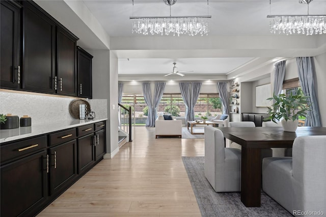 1815 Avery Way, Castle Rock, CO 80109 - dining space featuring light wood-style floors, ceiling fan, and a chandelier
