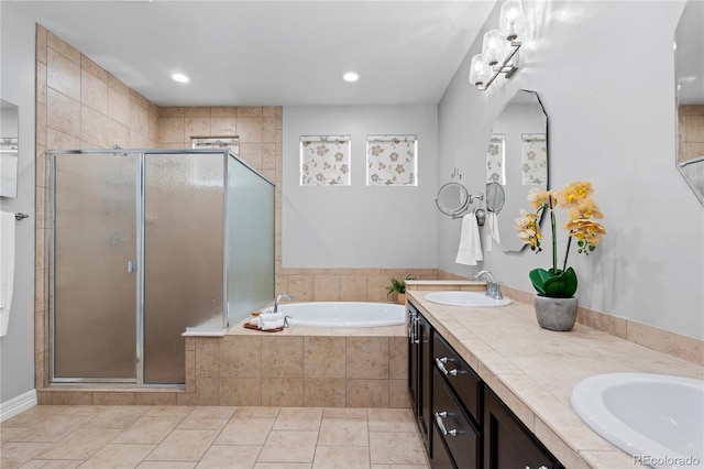 1815 Avery Way, Castle Rock, CO 80109 - full bath with double vanity, a stall shower, a garden tub, and recessed lighting
