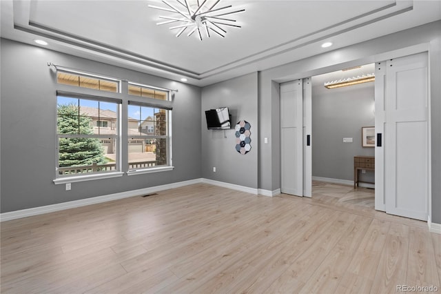 1815 Avery Way, Castle Rock, CO 80109 - spare room with light wood-style floors, recessed lighting, and a chandelier