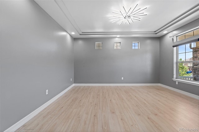 1815 Avery Way, Castle Rock, CO 80109 - spare room with a tray ceiling, wood finished floors, and recessed lighting