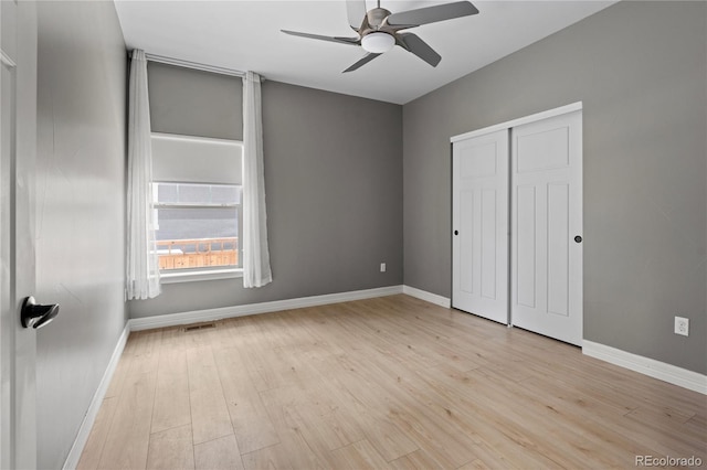 1815 Avery Way, Castle Rock, CO 80109 - unfurnished bedroom with light wood-style floors, a closet, and a ceiling fan
