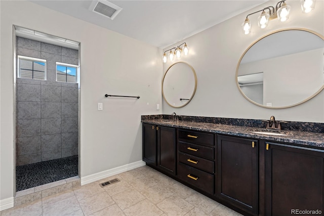 1815 Avery Way, Castle Rock, CO 80109 - bathroom featuring double vanity, a walk in shower, and tile patterned floors