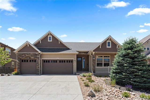 1815 Avery Way, Castle Rock, CO 80109 - craftsman-style house with a garage, a porch, concrete driveway, stone siding, and a shingled roof