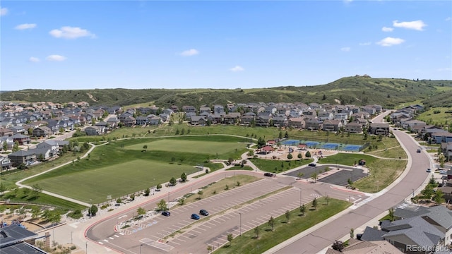 1815 Avery Way, Castle Rock, CO 80109 - aerial view of property and surrounding area featuring nearby suburban area and a mountainous background
