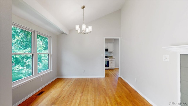 1006 Homestake Dr Unit 1D, Golden, CO 80401 - unfurnished dining area featuring a chandelier, light wood-style flooring, and lofted ceiling