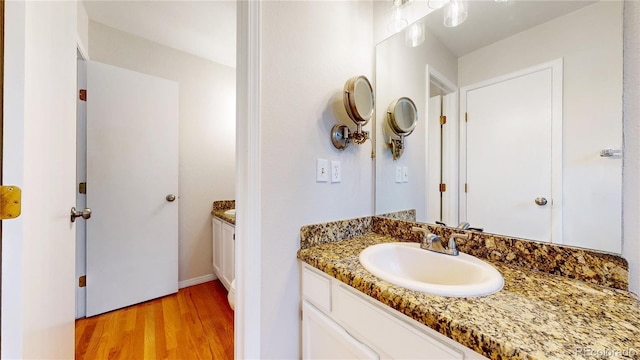 1006 Homestake Dr Unit 1D, Golden, CO 80401 - bathroom with vanity and wood finished floors