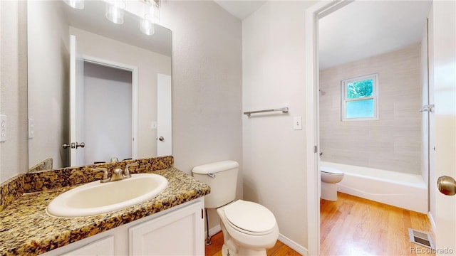 1006 Homestake Dr Unit 1D, Golden, CO 80401 - full bath featuring wood finished floors, vanity, and shower / bathtub combination