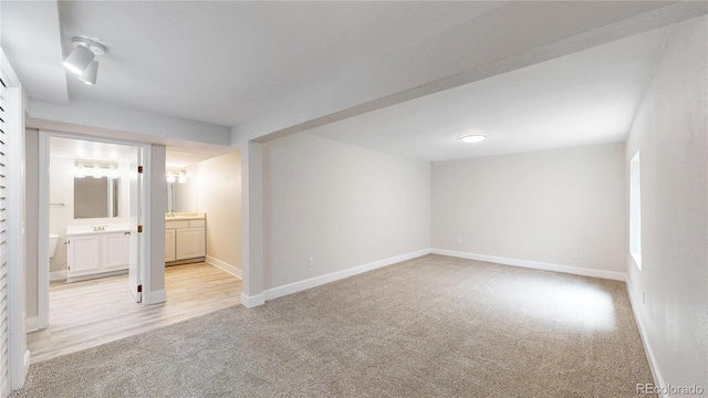 1006 Homestake Dr Unit 1D, Golden, CO 80401 - basement with light carpet and baseboards