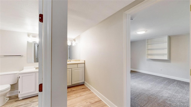 1006 Homestake Dr Unit 1D, Golden, CO 80401 - bathroom with vanity and wood finished floors