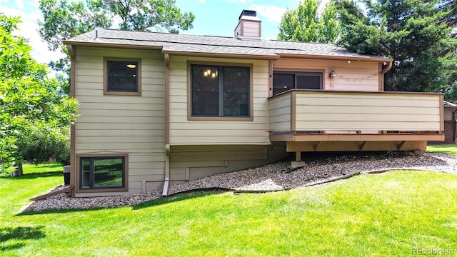 1006 Homestake Dr Unit 1D, Golden, CO 80401 - rear view of house with a yard, a chimney, and a wooden deck