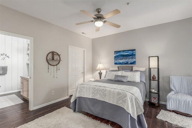 457 Black Feather Loop Unit 702, Castle Rock, CO 80104 - bedroom with baseboards, wood finished floors, ceiling fan, and ensuite bathroom