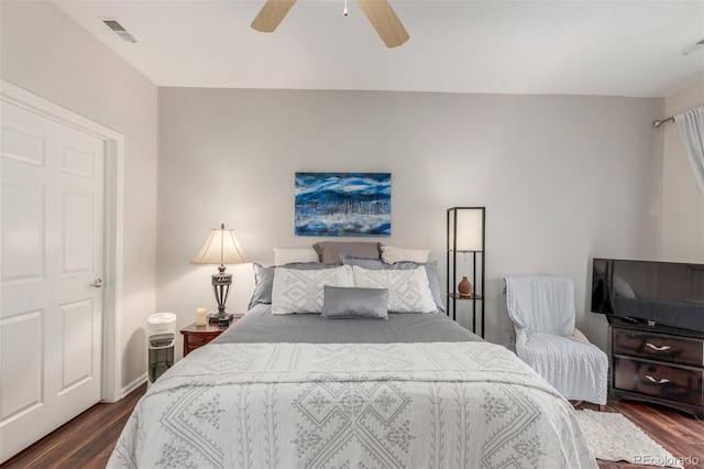 457 Black Feather Loop Unit 702, Castle Rock, CO 80104 - bedroom featuring dark wood finished floors and ceiling fan