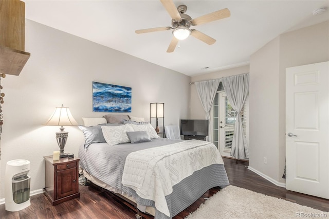 457 Black Feather Loop Unit 702, Castle Rock, CO 80104 - bedroom with access to outside, dark wood-type flooring, baseboards, and a ceiling fan