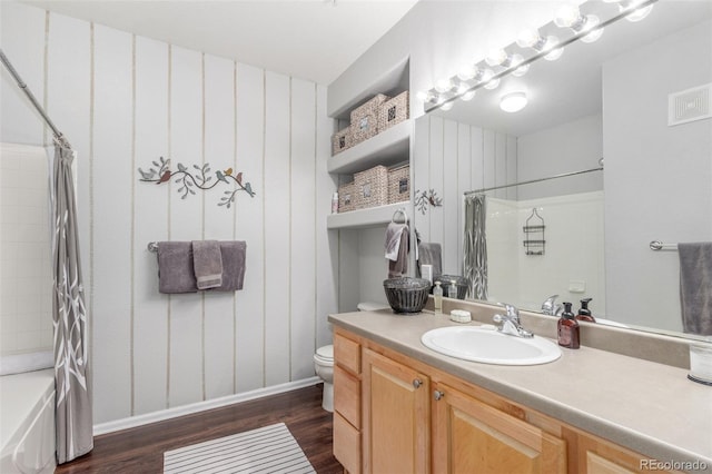457 Black Feather Loop Unit 702, Castle Rock, CO 80104 - full bathroom featuring wood finished floors, toilet, shower / bath combo, and vanity