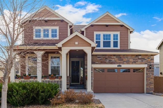 craftsman-style home with a porch and a garage