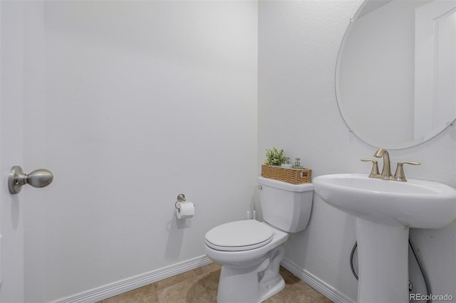 bathroom featuring tile patterned floors and toilet