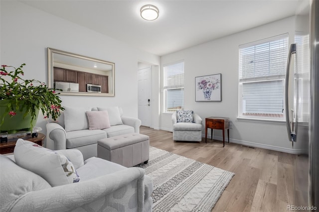 living room with light hardwood / wood-style floors