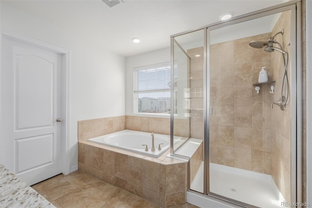 bathroom featuring separate shower and tub and tile patterned flooring