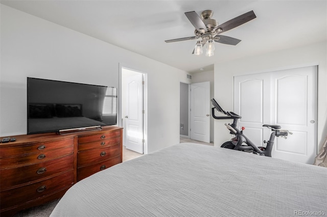 bedroom featuring ceiling fan and light colored carpet