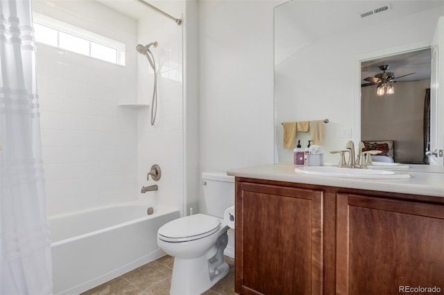 full bathroom featuring shower / bath combo, tile patterned floors, vanity, ceiling fan, and toilet