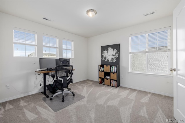 office space with light colored carpet