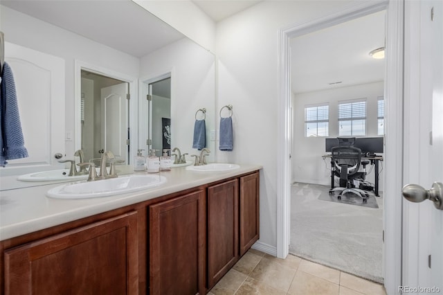 bathroom with tile patterned flooring and vanity