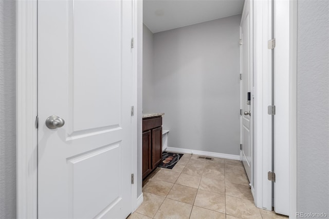 interior space featuring tile patterned flooring and vanity