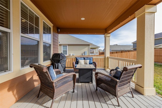 wooden terrace featuring outdoor lounge area