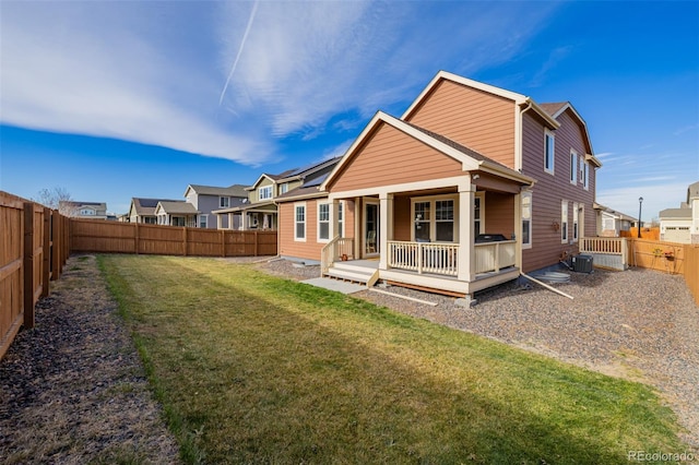 rear view of property with a yard, central AC unit, and a deck