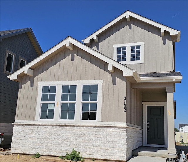 2102 Wagon Wheel Aly, Brighton, CO 80601 - view of front of house featuring stone siding and a shingled roof