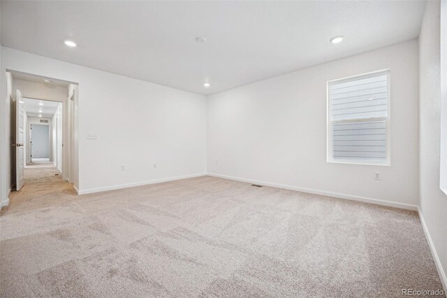 2102 Wagon Wheel Aly, Brighton, CO 80601 - unfurnished room featuring light colored carpet and recessed lighting