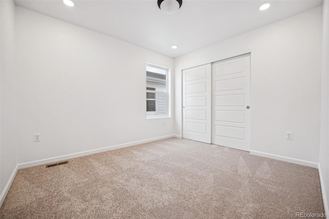 2102 Wagon Wheel Aly, Brighton, CO 80601 - unfurnished bedroom with carpet floors, a closet, and recessed lighting