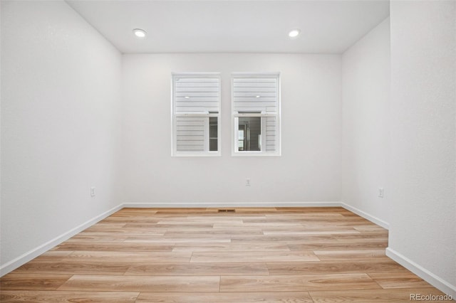 2102 Wagon Wheel Aly, Brighton, CO 80601 - empty room featuring light wood finished floors and recessed lighting