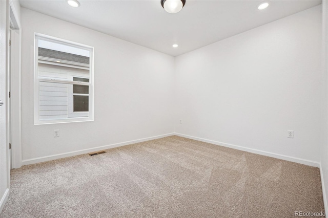 2102 Wagon Wheel Aly, Brighton, CO 80601 - spare room with carpet and recessed lighting