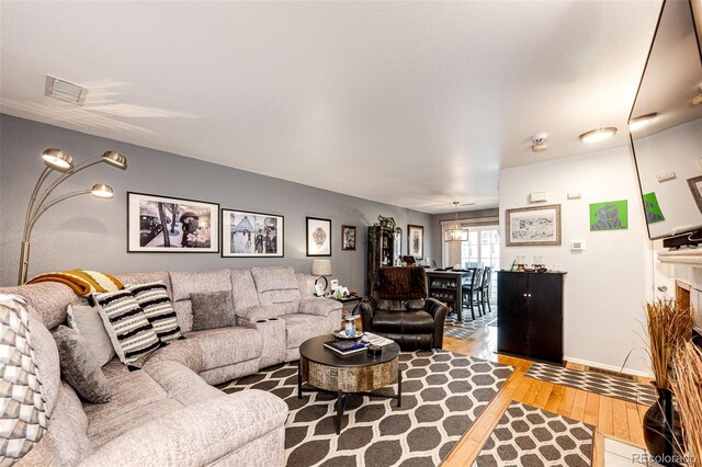1372 S Cathay Ct Unit 104, Aurora, CO 80017 - living area featuring wood-type flooring
