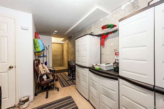 1372 S Cathay Ct Unit 104, Aurora, CO 80017 - miscellaneous room with a textured ceiling