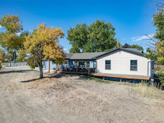 view of front of house featuring a wooden deck