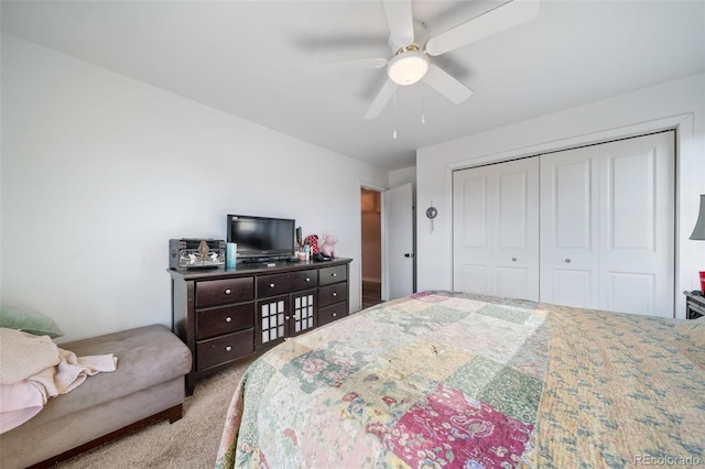 bedroom featuring carpet floors, a closet, and a ceiling fan