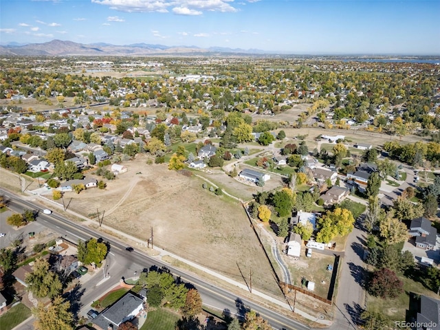 drone / aerial view featuring a residential view and a mountain view