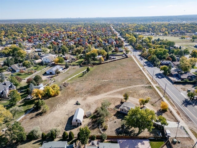 birds eye view of property with a residential view