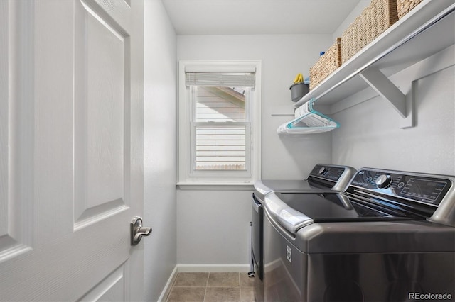 laundry room featuring washer and dryer, laundry area, baseboards, and tile patterned flooring