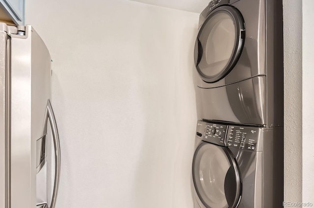 laundry area featuring stacked washer and dryer