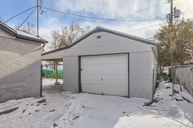 view of snow covered garage