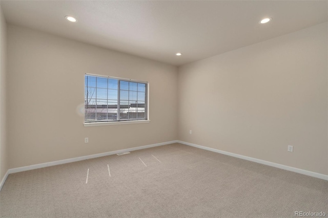 unfurnished room featuring baseboards, carpet flooring, and recessed lighting