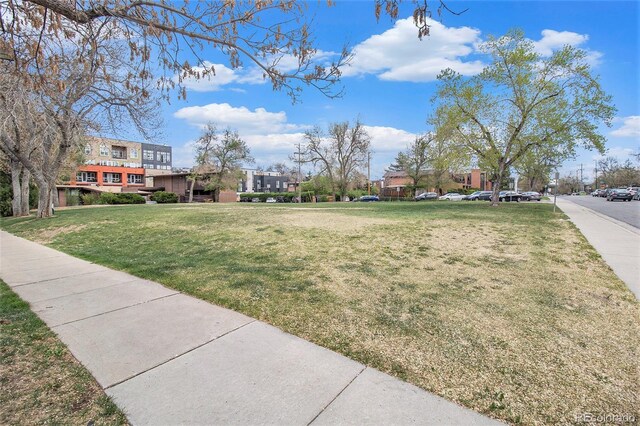 view of home's community featuring a lawn