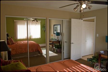 bedroom with two closets and ceiling fan