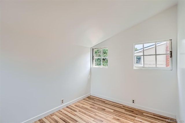 1654 S Pearl St, Denver, CO 80210 - empty room with vaulted ceiling and light wood-style floors