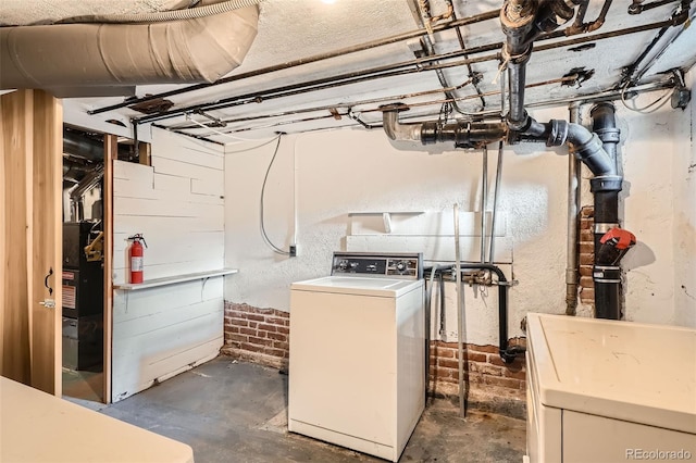 1654 S Pearl St, Denver, CO 80210 - unfinished basement featuring washer / dryer