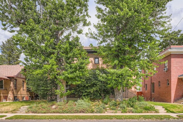 1654 S Pearl St, Denver, CO 80210 - view of side of property with brick siding and cooling unit